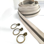 Leekayer #5 Antique Brass Metallic Nylon Coil Zippers by The Yard Bulk 10 Yards Beige Zipper Tape with 25pcs Antique Brass Ring Pull Sliders for DIY Sewing Tailor Craft Bag(Beige)